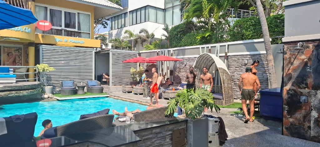 Palm-lined pool scene at a Pattaya spa